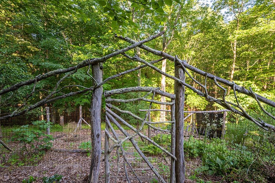 A rustic twig garden gate in the Bent Creek Lodge gardens
