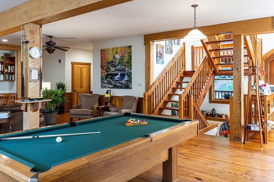The pool table and staircase in the Bent Creek Lodge great room
