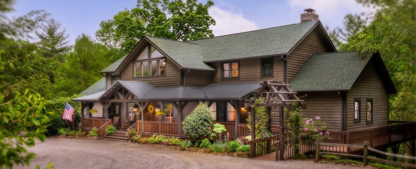 Bent Creek Lodge at dusk, a timber mountain lodge in the woods at Arden, North Carolina