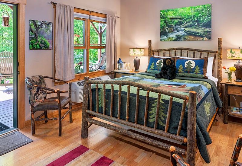 The Tree Room at Bent Creek Lodge with a queen bed made of cherry branches